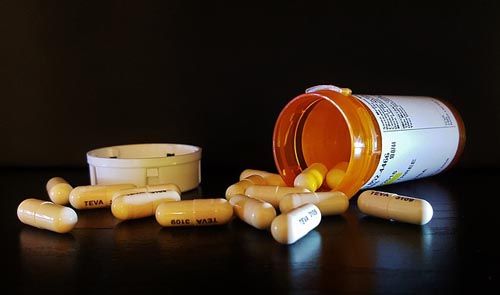 Prescription drugs are on a counter.